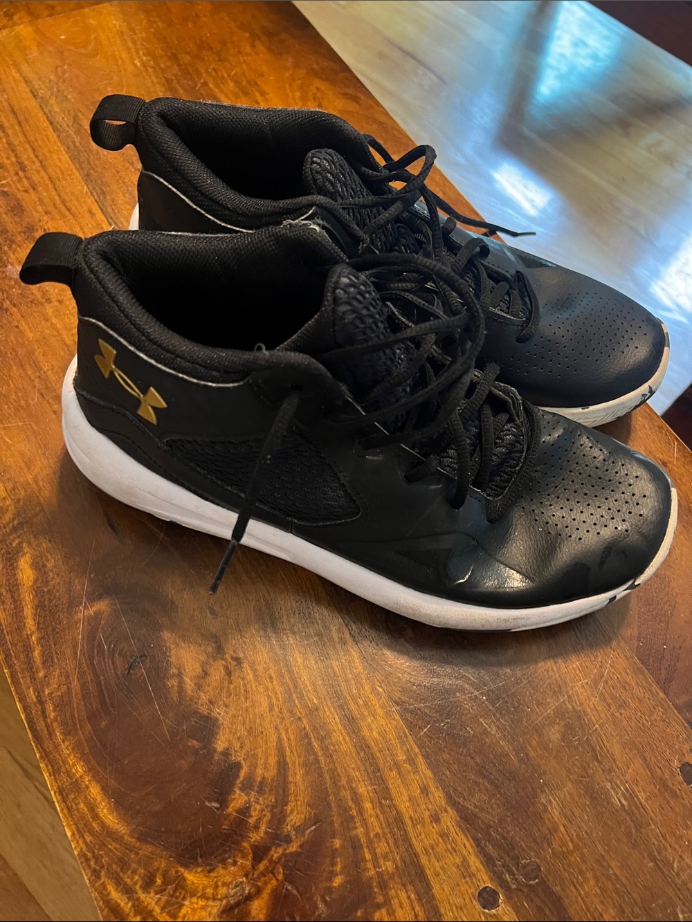 Under Armour Black and White Performance Sneakers with Gold Logo